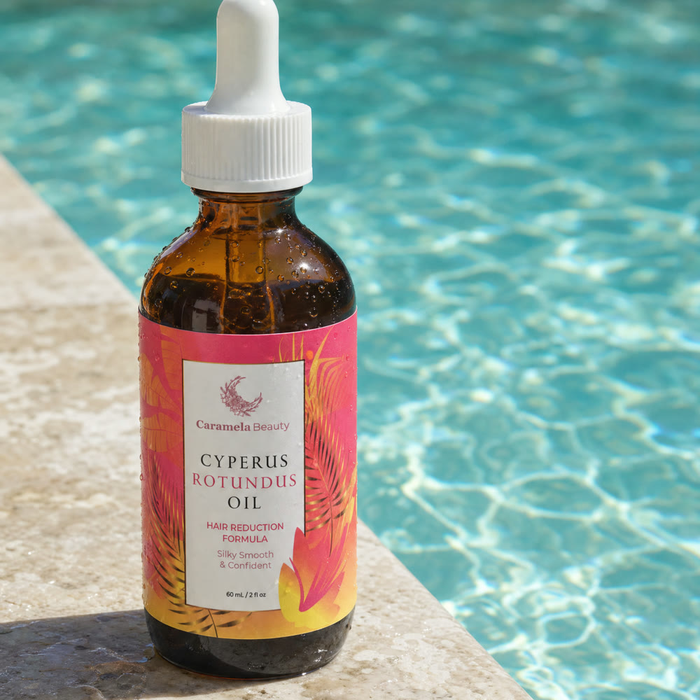 Caramela Cyperus Rotundus Oil bottle at the edge of a pool