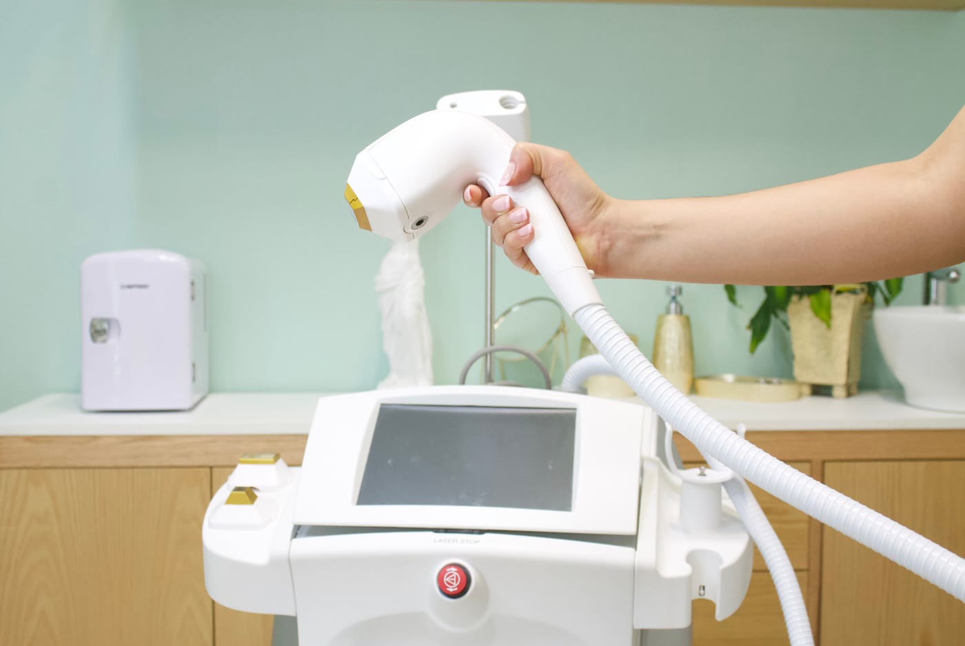 Laser hair removal machine and handpiece in a clinic